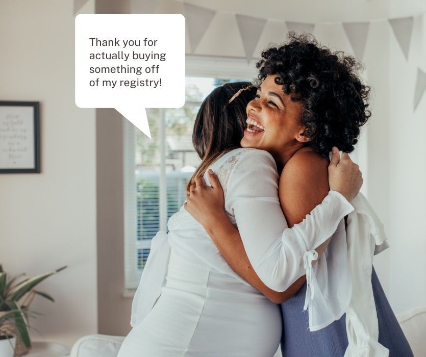 pregnant woman hugging friend saying, "thank you for actually buying something off of my registry."