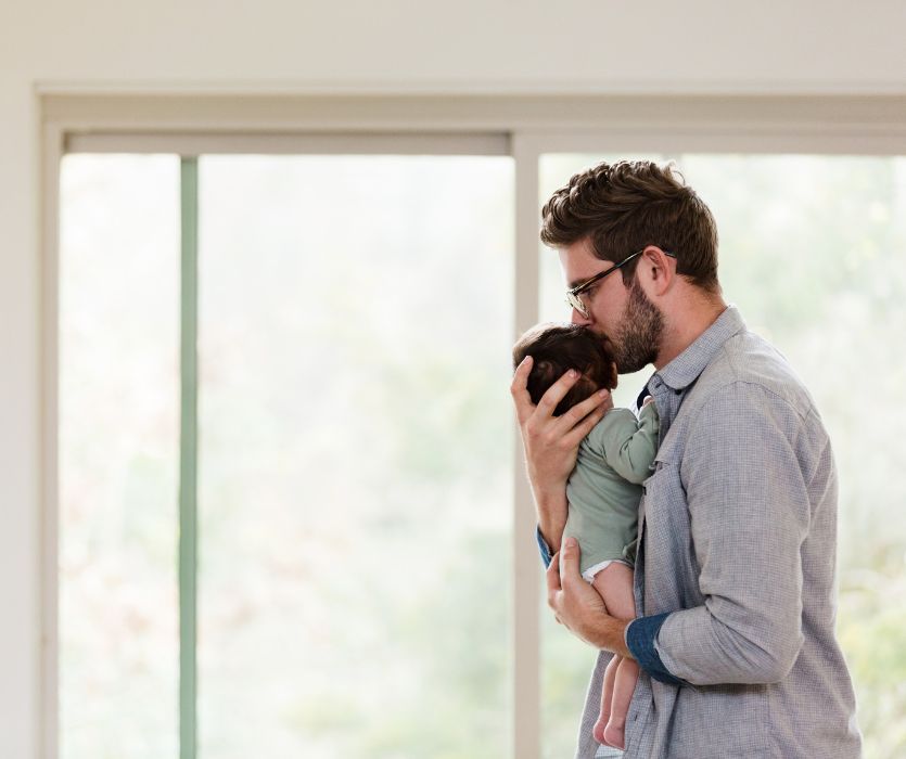Dad carrying his Crying Baby to get him to sleep