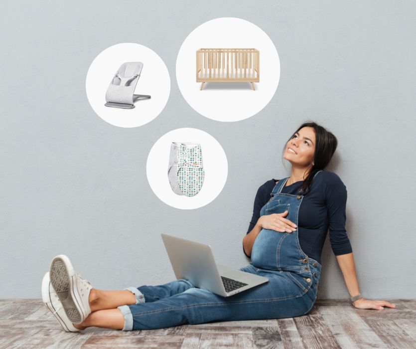 pregnant mom looking at baby gear while setting up her baby registry online