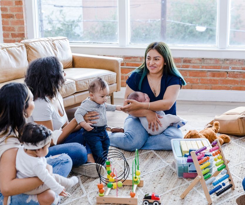 three mom friends with thier babies