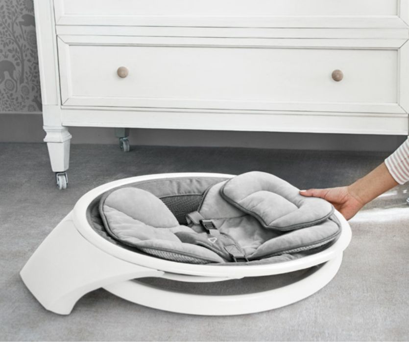 compact baby swing folded to slide under nursery drawers