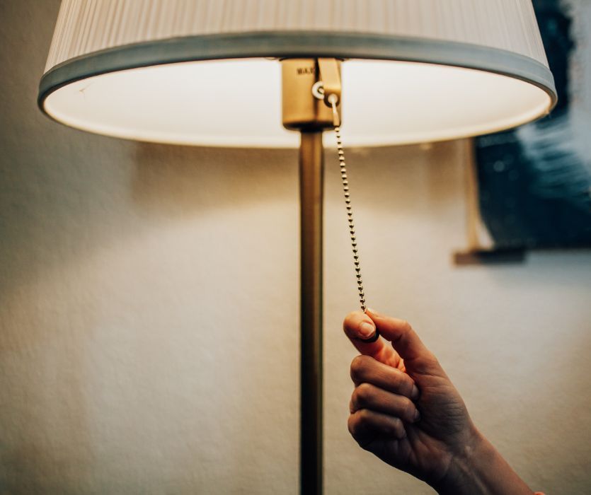 pregnant woman getting an electrical shock from lamp