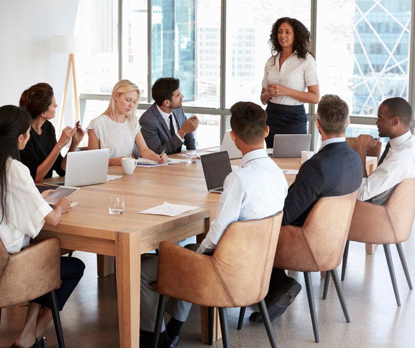 new mom leading a meeting in an office