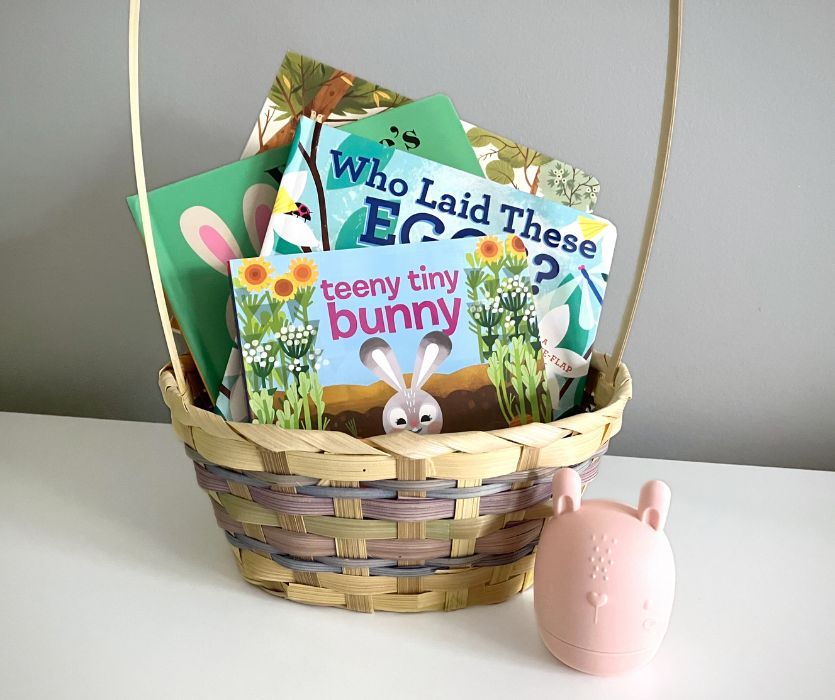 easter basket filled with board books and pink bunny bathtoy