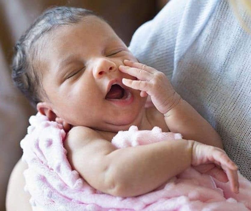 baby girl yawning after a surprise homebirth