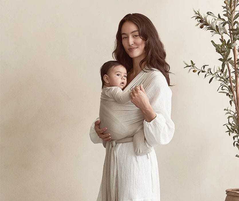 mom holding her baby in a stretchy wrap