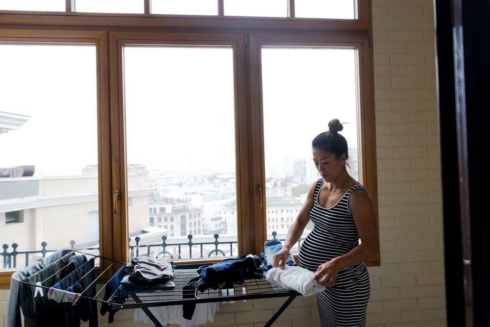 pregnant woman nesting organizing clothes, is nesting a reliable labor predictor?