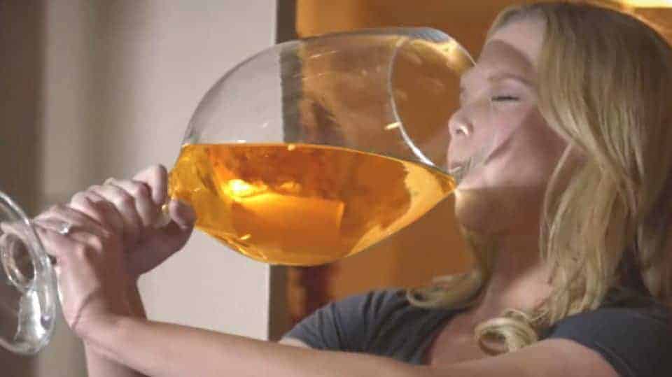 woman chugging out of glass - glucose test humor