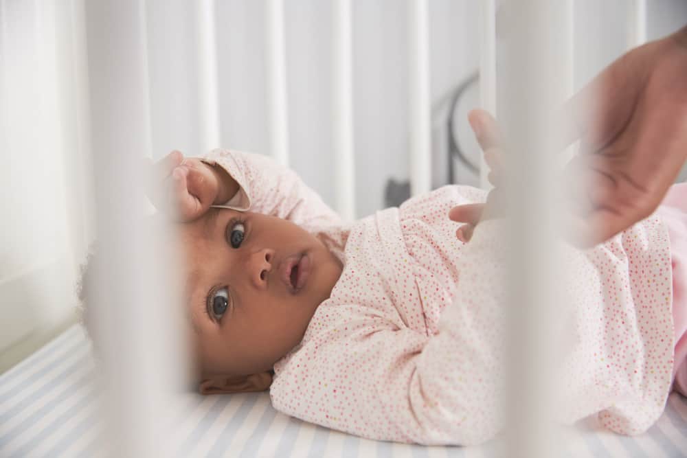 The Cry-Just-A-Little Sleep Training Method with baby girl in crib