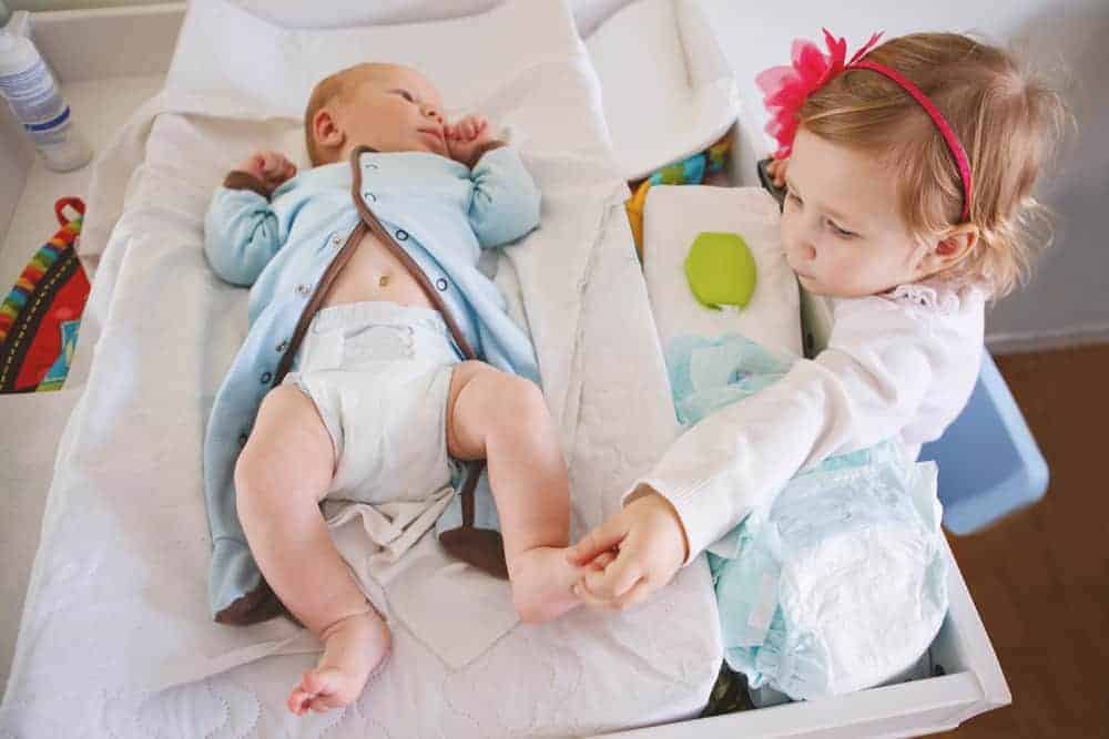 mom of two small children playing together