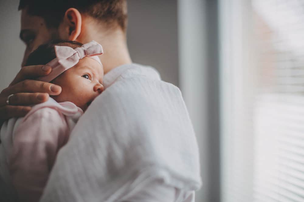 Dad holding baby - newborn life from a dad's perspective
