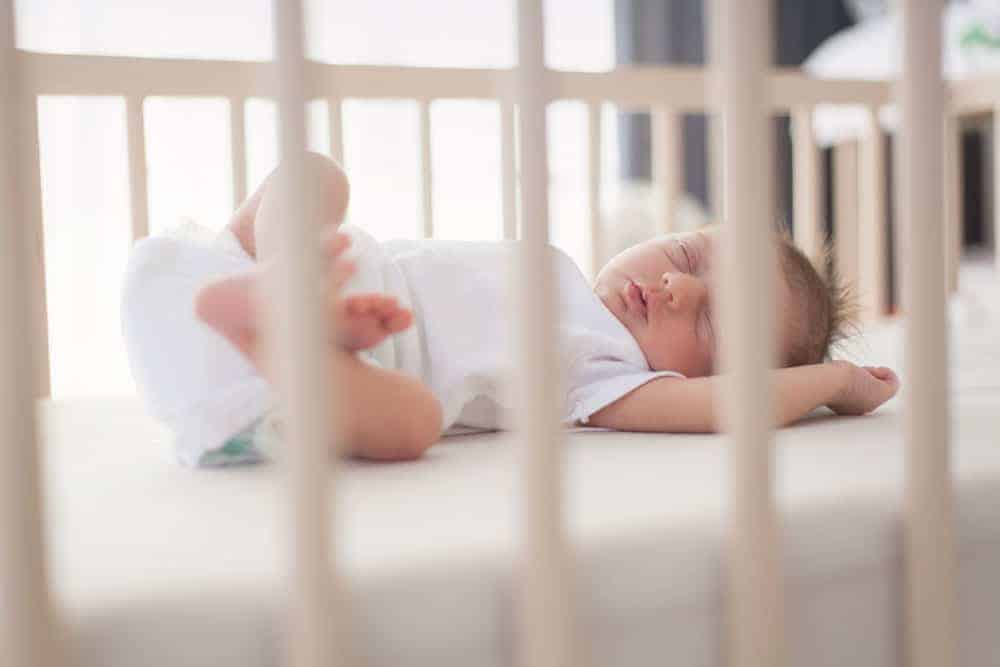 baby in crib using safe sleep guidelines